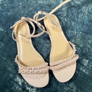 Guess tan flats with spikes.